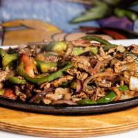 Fajitas · Tender sliced grilled chicken or beef with tomatoes, onion and bell peppers served with rice...