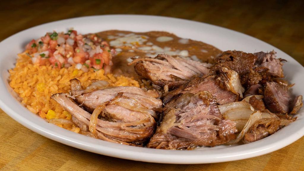 Carnitas · TenDer pork tips with rice and beans, pico De gallo, jalapeño peppers and two tortillas.