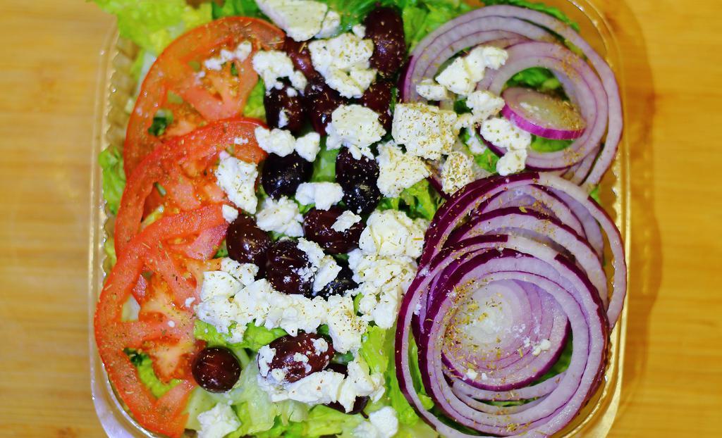 Greek Salad · Crispy romaine, feta, cheese, fresh tomatoes, red onion, calamata olives, oil and oregano.