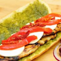 Liberty'S · Grilled chicken breast, mozzarella, roasted pepper, sun-dried tomatoes, pesto and olive oil.