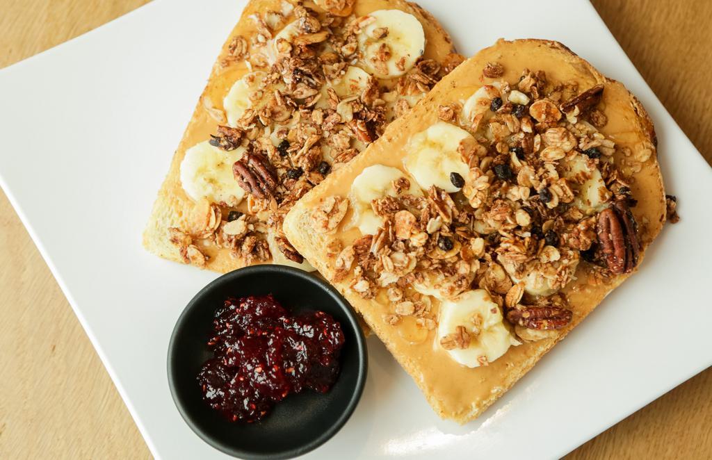Pb Banana Crunch And Jam · With peanut butter, banana, granola crumble, and agave on sourdough.