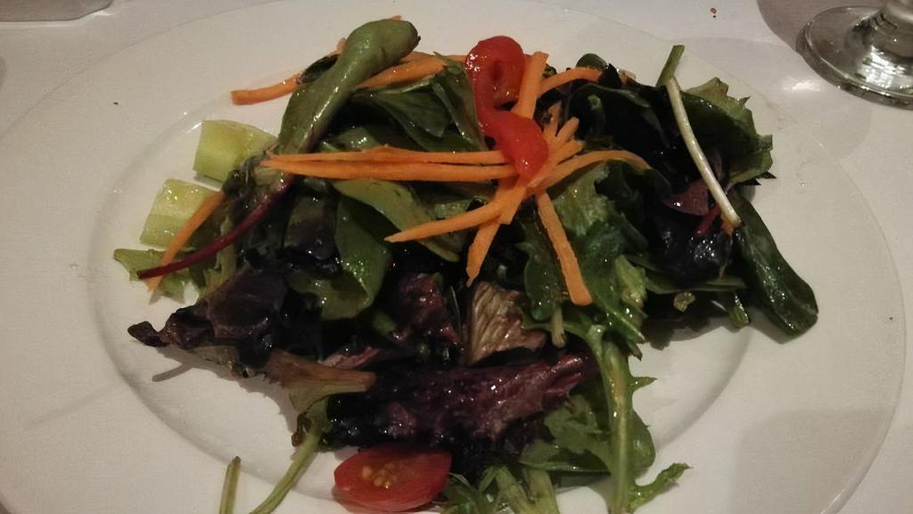 House Salad · Mixed greens, grape, tomatoes, cucumber, shredded carrots, roasted red peppers, balsamic vinaigrette.