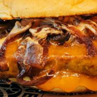 Henry Ford Burger · 1/4 POUND USDA Prime Bacon Blend, Cheddar Cheese, Caramelized Onions, House Sauce on a Marti...