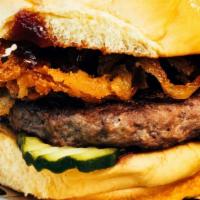 Saratoga Burger · 1/4 POUND USDA Prime Signature Blend, Pickles, BBQ Sauce and Onion Straws on a Martin’s Pota...