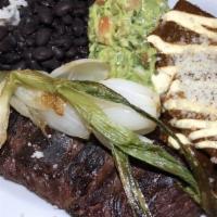 Carne Asada Tampiquena · Tequila marinated skirt steak, grilled onions, guacamole, mole enchilada, white rice, black ...