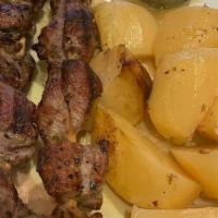 Pork Souvlaki Platter · Two sticks. served with tzatziki sauce greek salad and your choice of add-on.