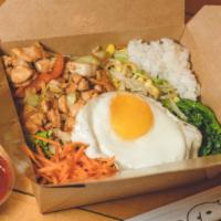 Chicken Bibimbap · Traditional Korean rice bowl with lightly seasoned and sautéed vegetables and chicken, toppe...