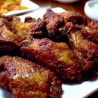 Extra Dokebi Spicy Wings · Let it burn !!! Served with a side of white pickled mu radish.