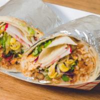 Vegan Spicy Tofu Burrito · All natural tofu sautéed with our spicy house-made Korean BBQ sauce,  wrapped in a flour tor...