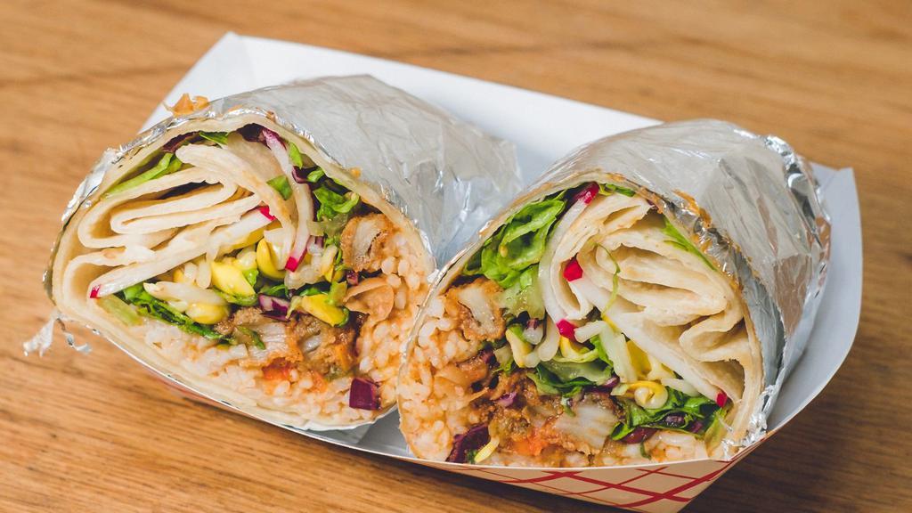 Fish Burrito · Lightly battered whiting, wrapped in a flour tortilla with rice, three bean chili, bean sprouts, lettuce, soy dressing, and radish