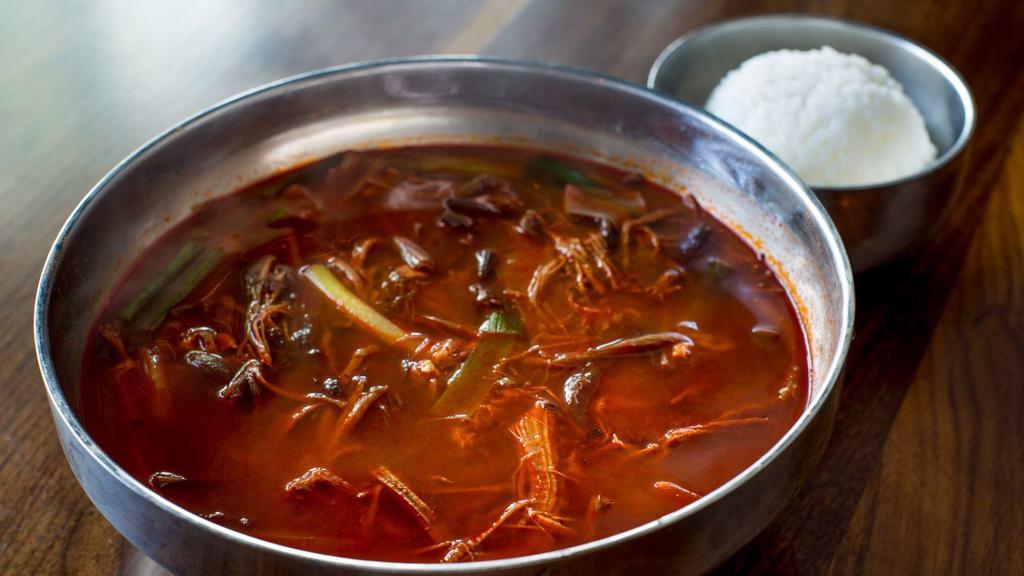 Yookgaejang (Yook-Kay-Jong) · More spicy. Traditional shredded beef brisket soup with scallions, Korean fernbrake, cellophane noodles and egg.