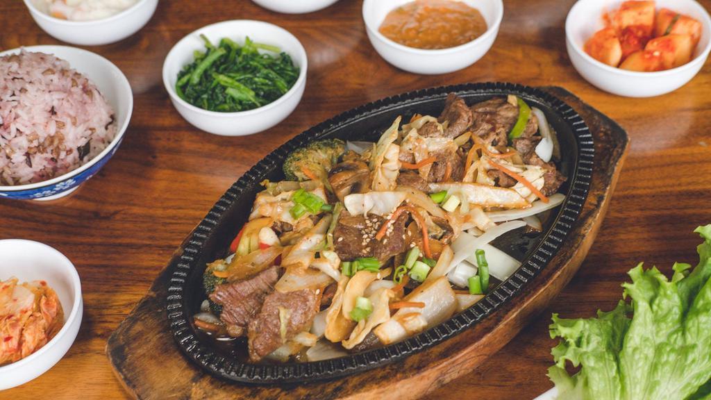 Kalbi Bbq · Marinated choice-angus beef short rib off the bone sautéed with broccoli, mushrooms, carrots, onions, and cabbage. Served with fresh veggies, bean paste, and choice of white rice or mixed grain rice