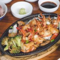 Black Tiger Shrimp Bbq · Jumbo black tiger shrimp served with broccoli,  onions, mushrooms, lemon,  wasabi soy sauce,...