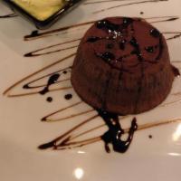 Chocolate Lava Cake · Warm, creamy, and with a raspberry drizzle.