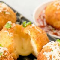 Arancini With Cheese · Arancini are Italian rice balls that are stuffed with mozzarella cheese,  coated with bread ...