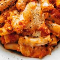 Baked Ziti With Roasted Chicken · Rigatoni pasta in our in house marinara sauce, with fresh ricotta, roasted chicken pieces, m...