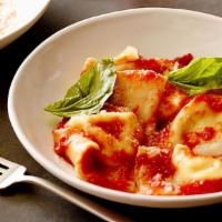 Ravioli · Cheese Ravioli Pasta in our in house marinara sauce topped with fresh basil and grated parme...