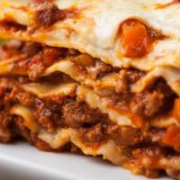 Lasagna · Layers of fresh pasta sheets, parmesan cheese, mozzarella cheese, ricotta cheese bolognese s...