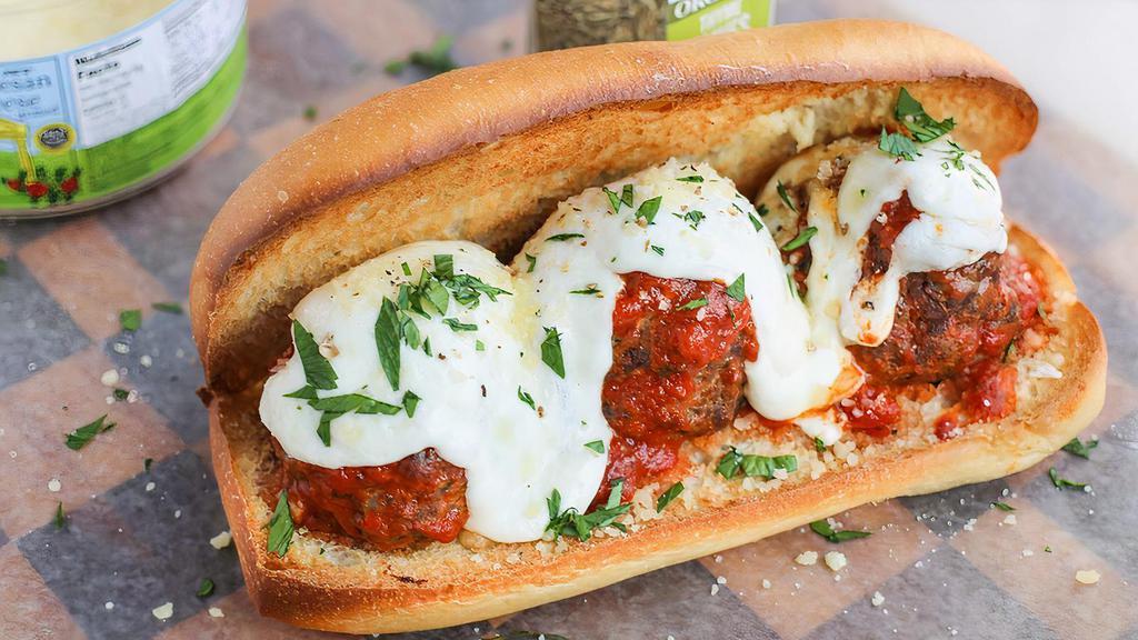 Meatball Parmigiana · Meatballs in our in house marinara sauce topped with melted grilled house blend of three cheeses in our toasted Italian sub roll.