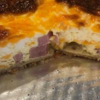 Ham And Cheese Quiche · This is a hearty, rich and filling quiche, fresh honey dew ham, cheddar cheese. Serve with a...