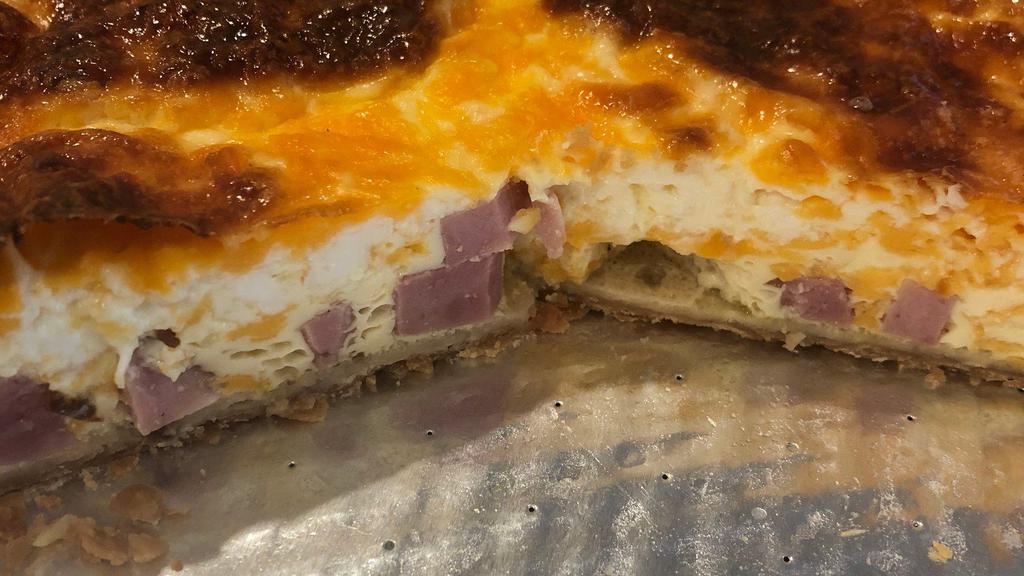 Ham And Cheese Quiche · This is a hearty, rich and filling quiche, fresh honey dew ham, cheddar cheese. Serve with a salad for a complete meal.