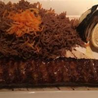 Adana Kebab · Grilled ground lamb with onion and special house seasoning. White or brown rice does not com...