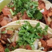 Tacos (3 Pieces) · Corn tortilla, pico de gallo or onion, cilantro, salsa, rice and beans.