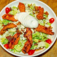 Crispy Buffalo Cobb Salad · Fried buffalo chicken and over chipped romaine, with egg, bacon, and bleu cheese crumbles, s...