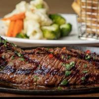 Churrasco (16 Oz) · Grilled juicy skirt steak, served with 2 sides / Servido con 2 acompañantes.