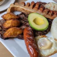 Bandeja Paisa · Typical Colombian dish served with beans, rice, grilled steak, Colombian sausage, pork crack...
