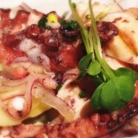 Grilled Spanish Octopus · Fingerling potato, chickpeas, cucumber, tomato compote.