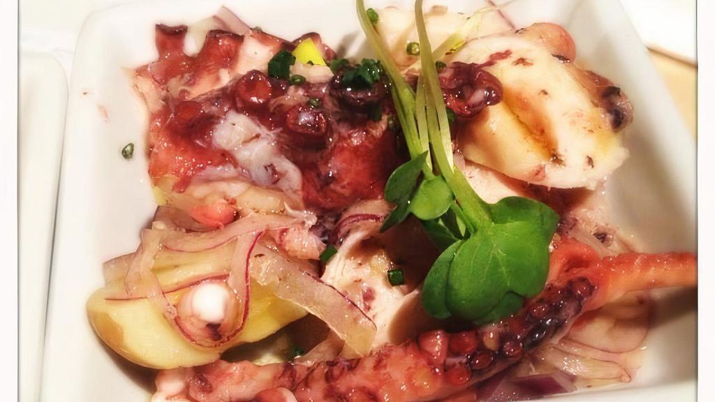 Grilled Spanish Octopus · Fingerling potato, chickpeas, cucumber, tomato compote.
