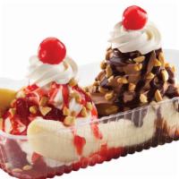 Banana Barge® · The ultimate way to trick out a banana with three scoops of ice cream vanilla, chocolate and...