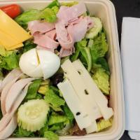 Sexy Chef'S Salad · Tossed romaine and mixed field greens with oven roasted turkey, ham, Swiss and American chee...