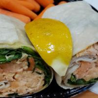 Sexy Thai Salmon Wrap · Made with fresh spinach, carrots, scallions and honey mustard dressing.