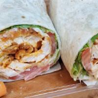 Sexy Buffalo Chicken Wrap · A breaded spicy buffalo chicken breast made with Monterey Jack, lettuce, and tomato.