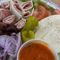 Antipasti Salad · Romaine Lettuce, Ham/Provolone roll ups, Roasted Peppers, Red Onions, Black Olives, Pepperon...