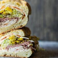 Nicky Boy · Turkey, Roast Beef, Provolone, Sun Dried Tomato Spread, Banana Peppers, Lettuce, Tomato, Oni...