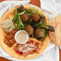 Falafel · Perfect blend of beans, herbs and spices ground into patties and lightly fried. Served over ...