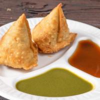 2 Pieces Samosa · With spiced potatoes, onions, peas and lentils.