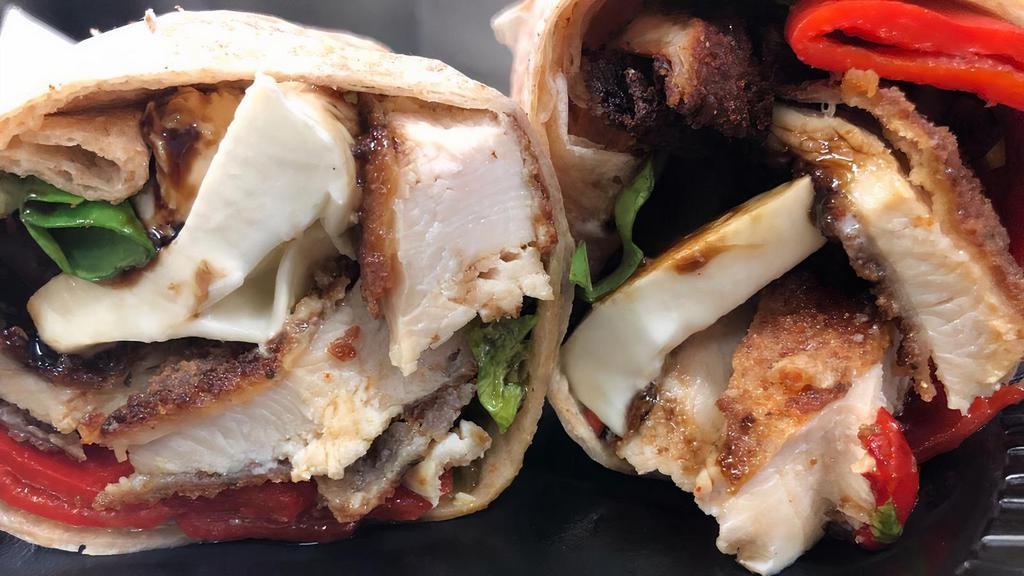 #10. 18Th Avenue · Breaded chicken, fresh mozzarella, roasted red peppers, spring mix and balsamic dressing in a wrap.