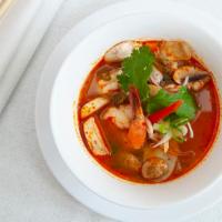 Tom Yum (Spicy Soup) · Chili, galangal, lemongrass, lime juice, and mushroom.