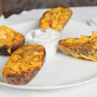 Jumbo Stuffed Potato Skins · stuffed with Cheddar Cheese & Bacon, served with Sour Cream
