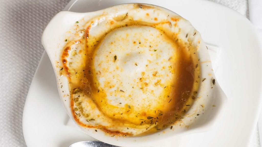 Crock Of French Onion Soup · topped with Melted Cheese