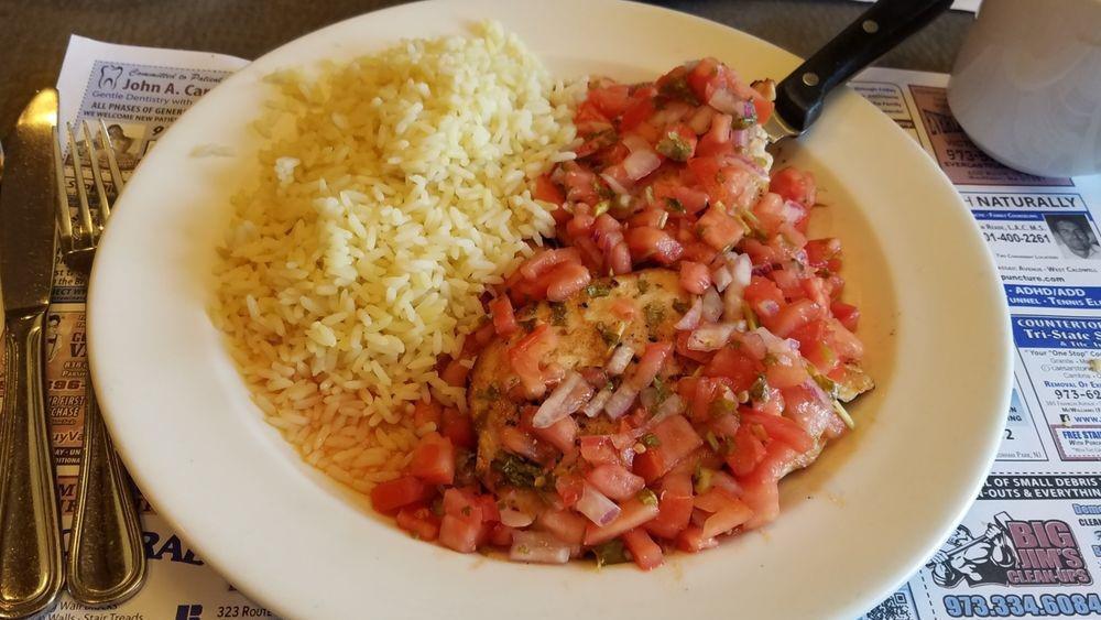 Chicken Argentino · Grilled Chicken Breast served with Tomatoes and Red Onions
in a Lemon Oil and Cilantro Sauce, served over Rice