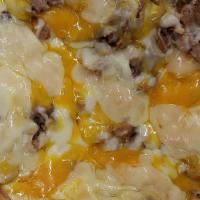 Trash Fries · Smothered with Provolone, Cheddar, and Mozzarella cheese plus sausage and steak.