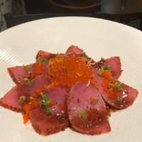 Pepper Tuna Tataki (8) · Seared pepper tuna and scallions, with onion radish.