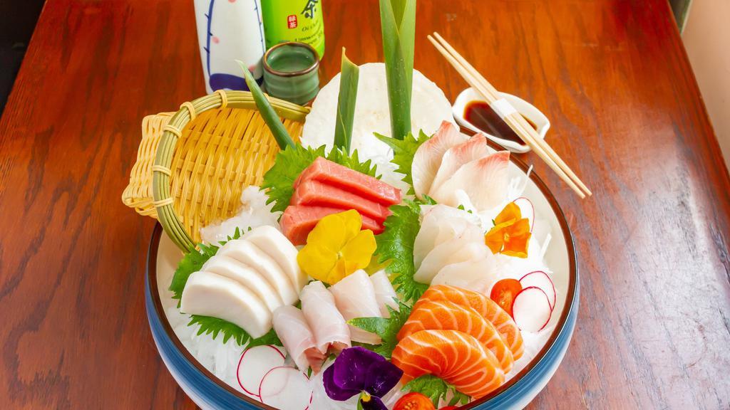 Sashimi Deluxe · 16 pieces. Assorted raw fish.