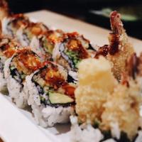 Shrimp Tempura Roll · Lettuce, avocado and cucumber inside, with tobiko outside and topped with eel sauce.