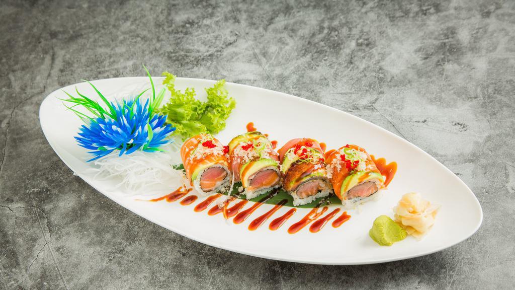Tiger Roll · Tuna, salmon inside, topped with tuna, salmon, eel, avocado, crunch, masago and scallion. Served with eel sauce.
